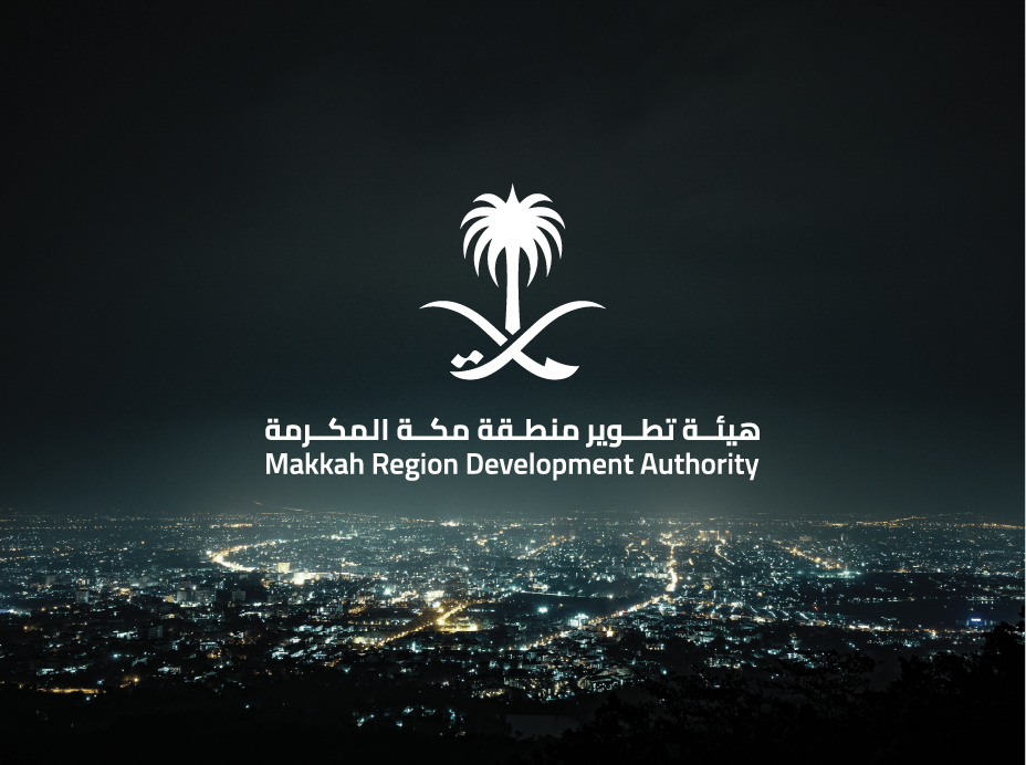 Makkah Region Development Authority emblem and bilingual logotype over a mountain landscape